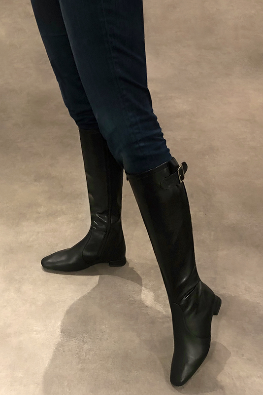 Satin black women's knee-high boots with buckles. Square toe. Flat flare heels. Made to measure. Worn view - Florence KOOIJMAN